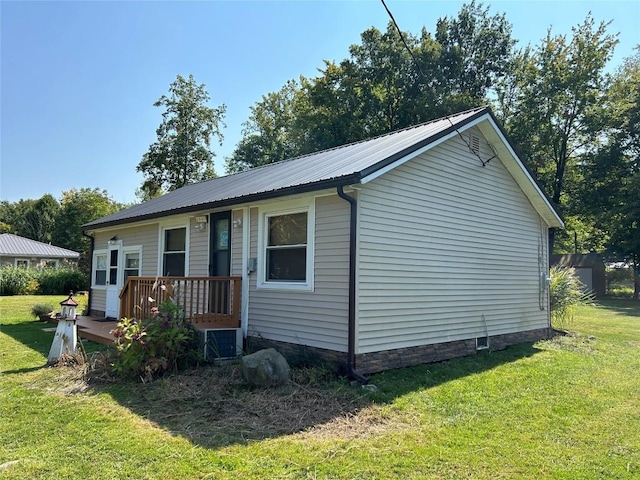 exterior space with a yard and a wooden deck