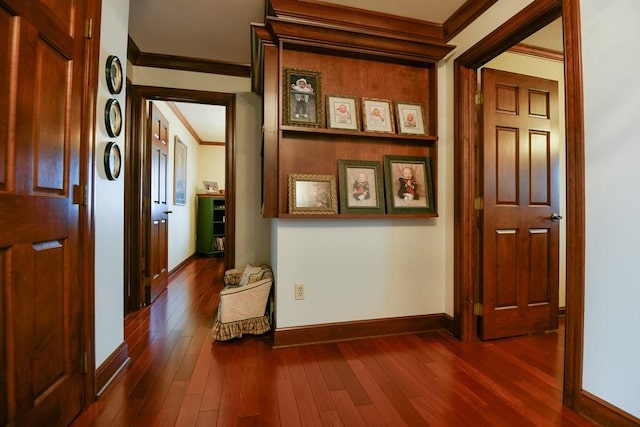 corridor with ornamental molding and dark hardwood / wood-style floors