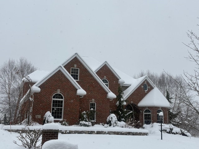 traditional-style home featuring brick siding