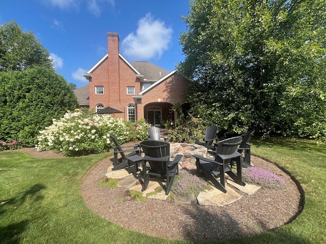 view of yard with an outdoor fire pit and a patio area