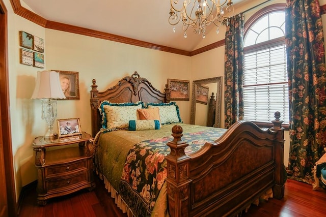 bedroom featuring vaulted ceiling, a chandelier, and dark hardwood / wood-style floors