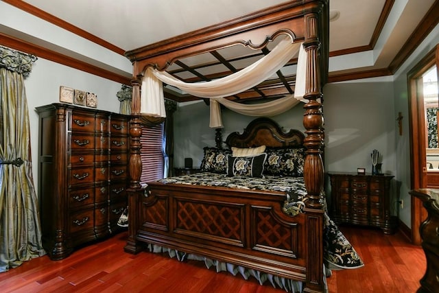 bedroom featuring crown molding and dark hardwood / wood-style floors