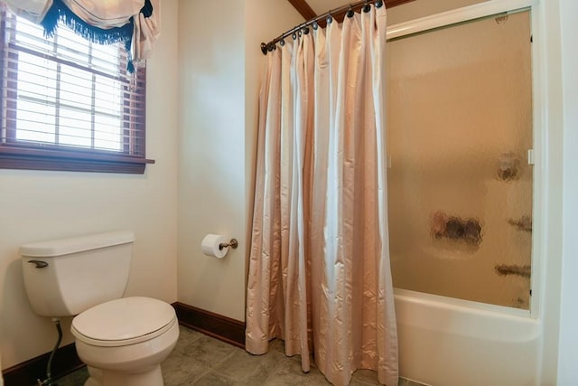 bathroom featuring toilet and shower / tub combo