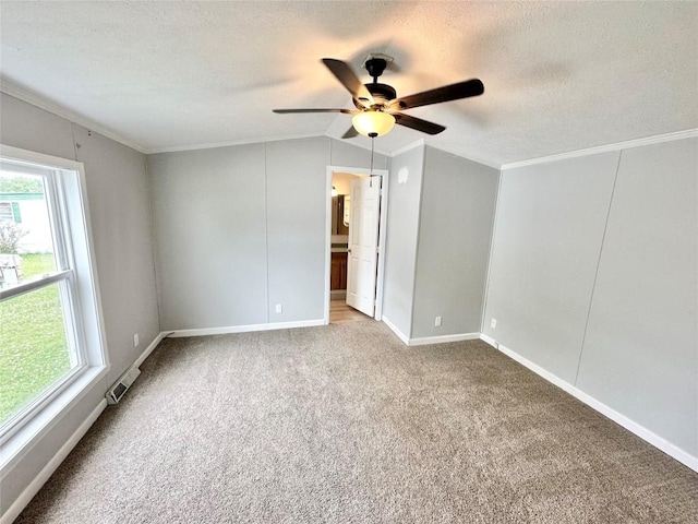 10644 W Main Rd Unit 45, North East, PA 16428 - carpeted spare room with ceiling fan, crown molding, vaulted ceiling, and a textured ceiling