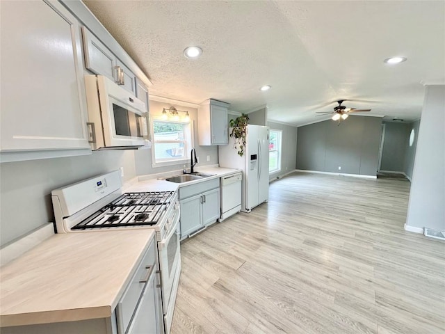 10644 W Main Rd Unit 45, North East, PA 16428 - kitchen with white appliances, ceiling fan, light wood-style floors, light countertops, and recessed lighting
