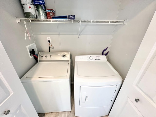 10644 W Main Rd Unit 45, North East, PA 16428 - washroom with separate washer and dryer and light wood finished floors