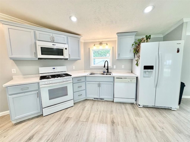 10644 W Main Rd Unit 45, North East, PA 16428 - kitchen featuring white appliances, light wood finished floors, light countertops, a textured ceiling, and recessed lighting