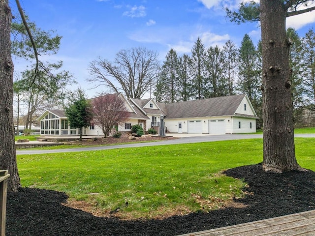11350 State Highway 618, Conneaut Lake, PA 16316 - view of front of home with a garage, asphalt driveway, and a front lawn