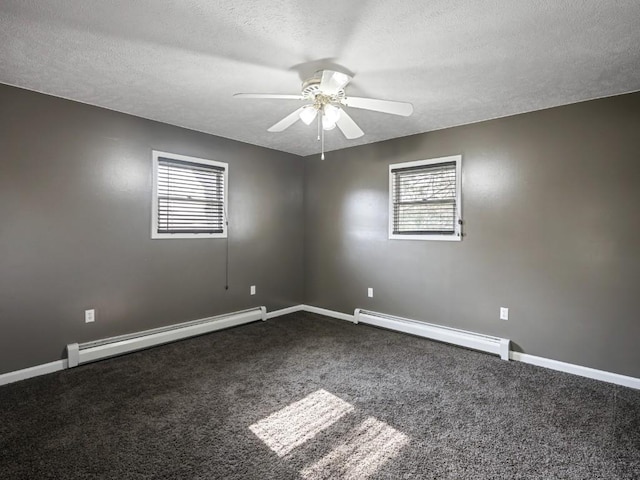 11350 State Highway 618, Conneaut Lake, PA 16316 - unfurnished room featuring a baseboard heating unit, dark colored carpet, ceiling fan, plenty of natural light, and a textured ceiling
