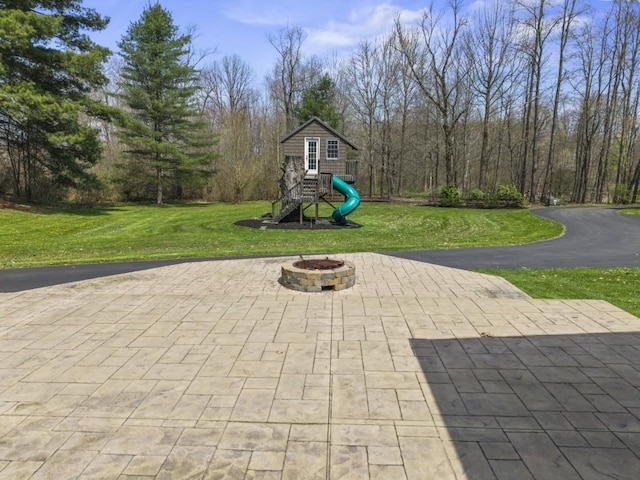 11350 State Highway 618, Conneaut Lake, PA 16316 - view of patio / terrace featuring a playground and an outdoor fire pit