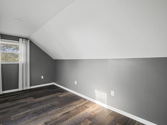 11350 State Highway 618, Conneaut Lake, PA 16316 - additional living space with baseboards, vaulted ceiling, and dark wood-style floors