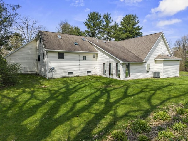 11350 State Highway 618, Conneaut Lake, PA 16316 - back of property featuring a lawn, central AC, and a shingled roof