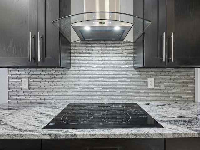 11350 State Highway 618, Conneaut Lake, PA 16316 - kitchen with range hood, black electric stovetop, decorative backsplash, and light stone countertops