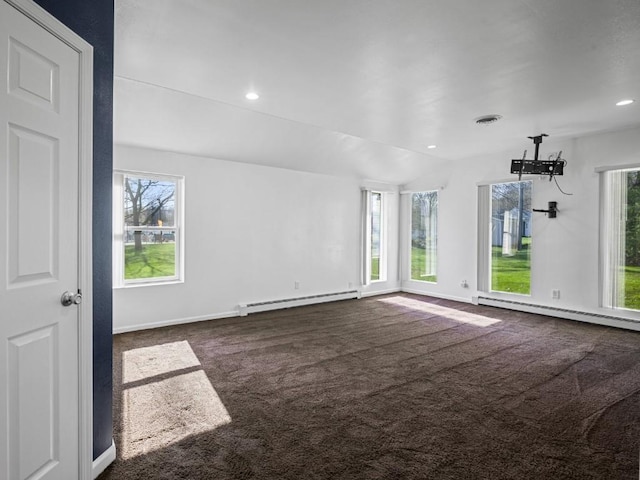 11350 State Highway 618, Conneaut Lake, PA 16316 - empty room featuring baseboard heating, dark carpet, healthy amount of natural light, and recessed lighting