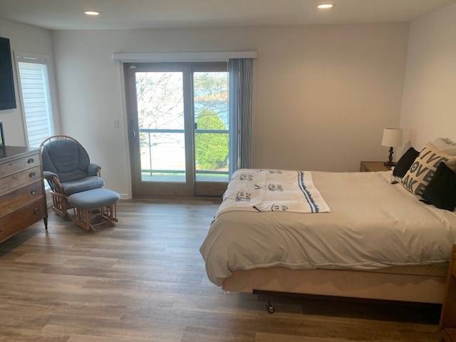 11148 Aldina Dr, Conneaut Lake, PA 16316 - bedroom with access to exterior, recessed lighting, and wood finished floors