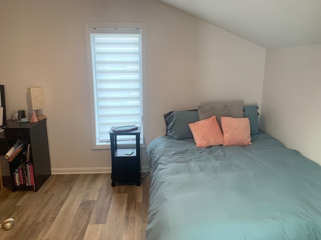 11148 Aldina Dr, Conneaut Lake, PA 16316 - bedroom featuring baseboards, lofted ceiling, and wood finished floors