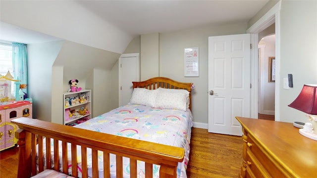 1450 Nicholson St, Erie, PA 16509 - bedroom with wood finished floors, lofted ceiling, and arched walkways