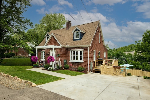 1450 Nicholson St, Erie, PA 16509 - view of front of property featuring brick siding, a chimney, roof with shingles, and a deck
