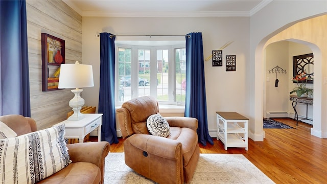 1450 Nicholson St, Erie, PA 16509 - sitting room with arched walkways, wood finished floors, crown molding, a baseboard heating unit, and a baseboard radiator