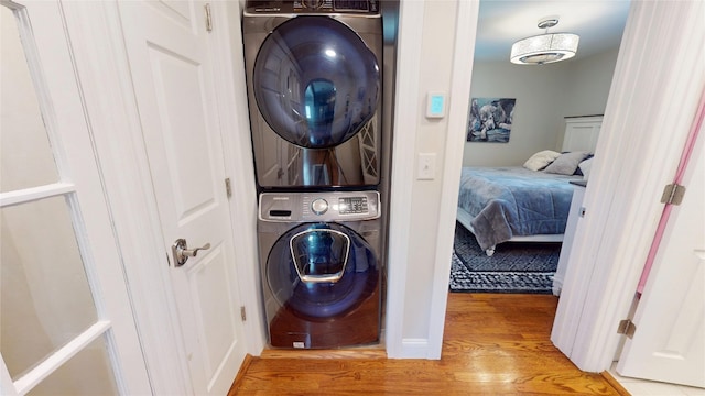 1450 Nicholson St, Erie, PA 16509 - laundry area with stacked washing machine and dryer and light wood finished floors