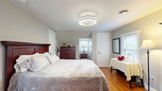 1450 Nicholson St, Erie, PA 16509 - bedroom featuring wood finished floors and two closets