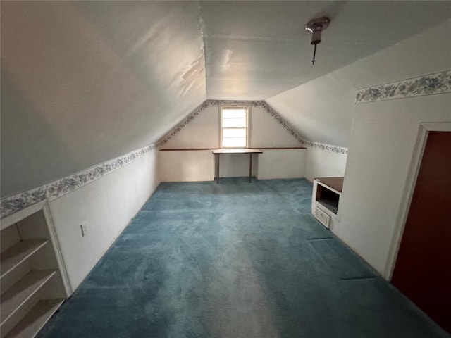 bonus room featuring lofted ceiling and carpet floors