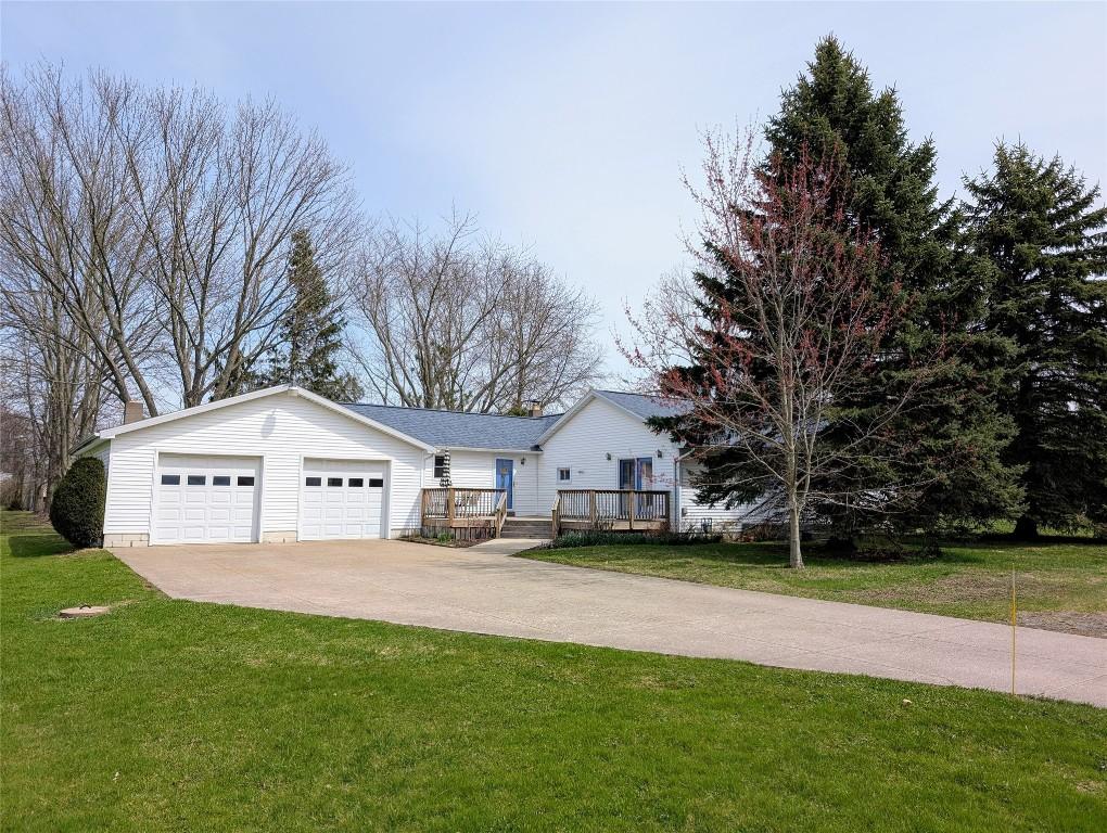 919 Walbridge Rd, Erie, PA 16510 - view of front of property featuring driveway, a front lawn, a deck, and a garage