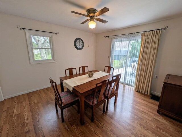 dining space featuring washer / clothes dryer, ceiling fan, light wood-style floors, and baseboards