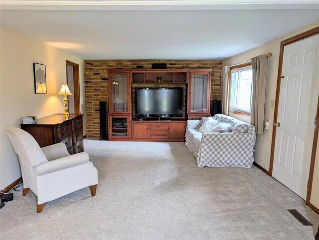 sitting room featuring light carpet and baseboards