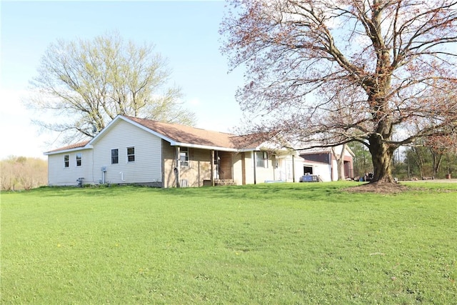 back of property with a yard