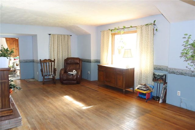 living area with hardwood / wood-style floors