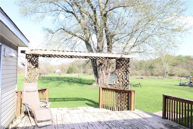 wooden deck featuring a yard