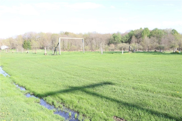 view of yard featuring a water view and a rural view