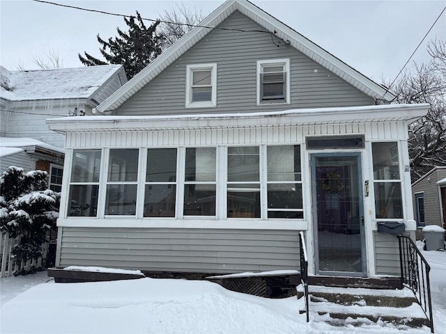 view of front facade featuring a sunroom