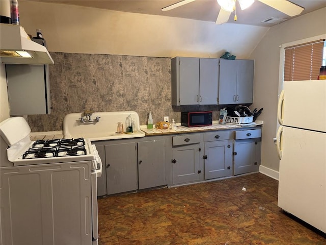 kitchen with lofted ceiling, white appliances, ceiling fan, tasteful backsplash, and gray cabinets