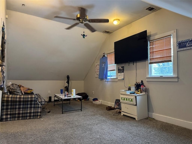 unfurnished office featuring ceiling fan, lofted ceiling, and carpet flooring