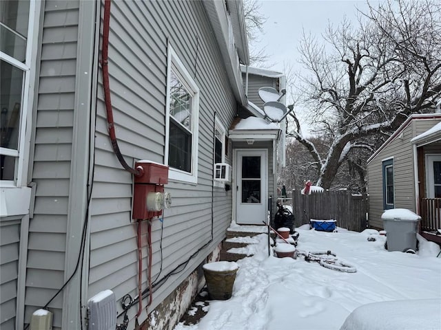 view of snow covered property entrance