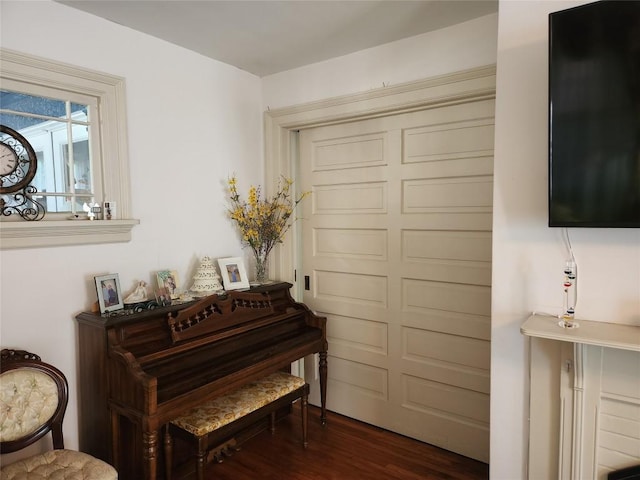 miscellaneous room with dark hardwood / wood-style flooring