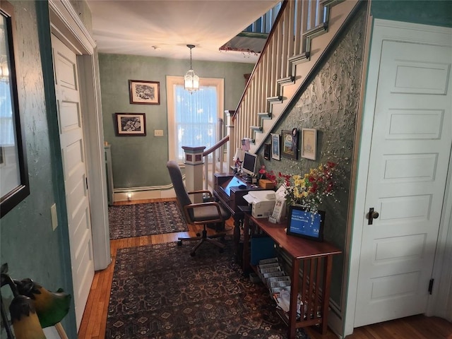 office featuring a chandelier and hardwood / wood-style floors