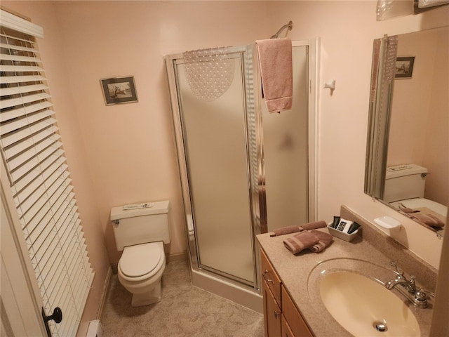 bathroom featuring vanity, toilet, a shower with door, and a baseboard heating unit