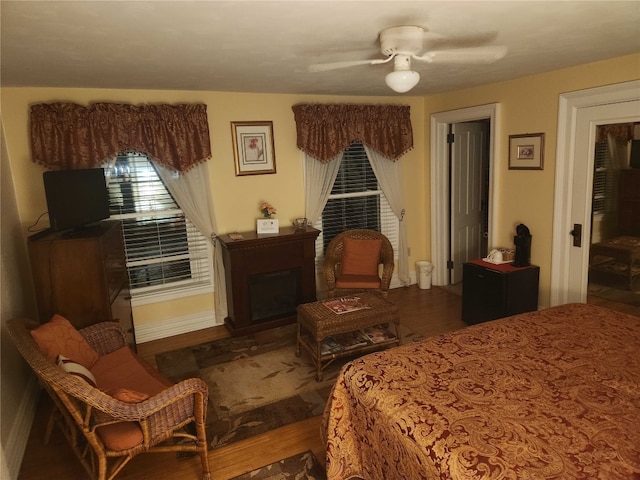 bedroom with hardwood / wood-style floors and ceiling fan