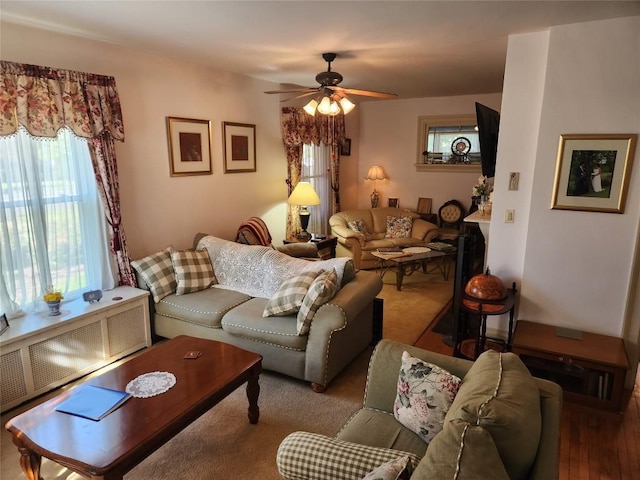 living room with radiator and ceiling fan