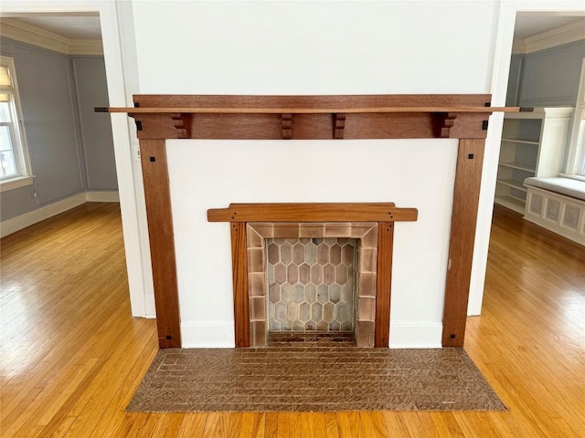 details with wood-type flooring and ornamental molding