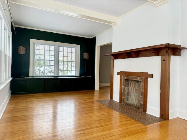 unfurnished living room featuring light wood-type flooring, crown molding, and a baseboard radiator