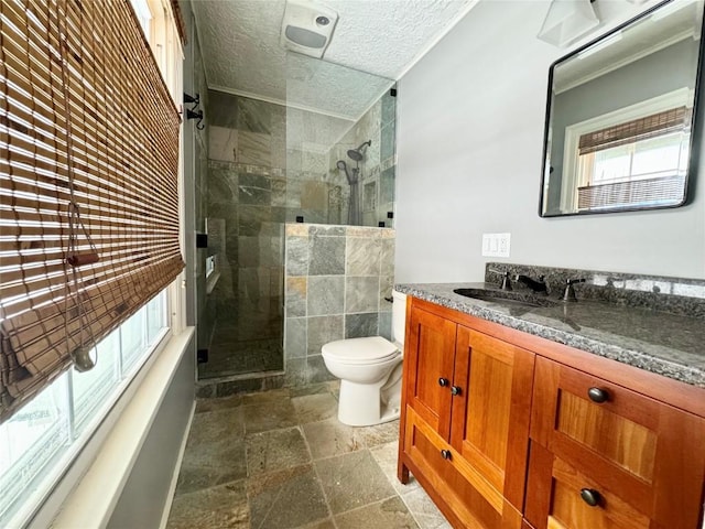 bathroom featuring vanity, toilet, and a shower with shower door