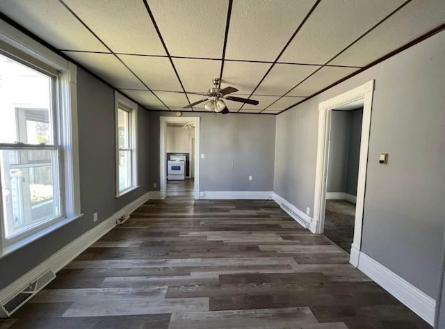 1121 E 27th St, Erie, PA 16504 - empty room with a drop ceiling, dark wood-style floors, baseboards, and a ceiling fan