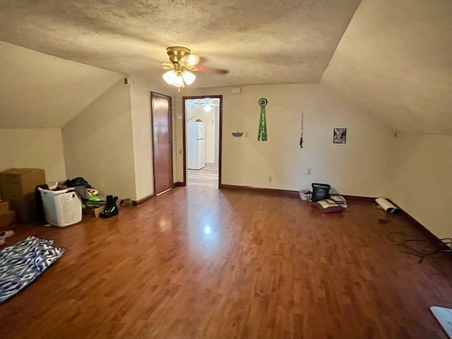 1121 E 27th St, Erie, PA 16504 - additional living space featuring wood finished floors, a ceiling fan, lofted ceiling, baseboards, and a textured ceiling