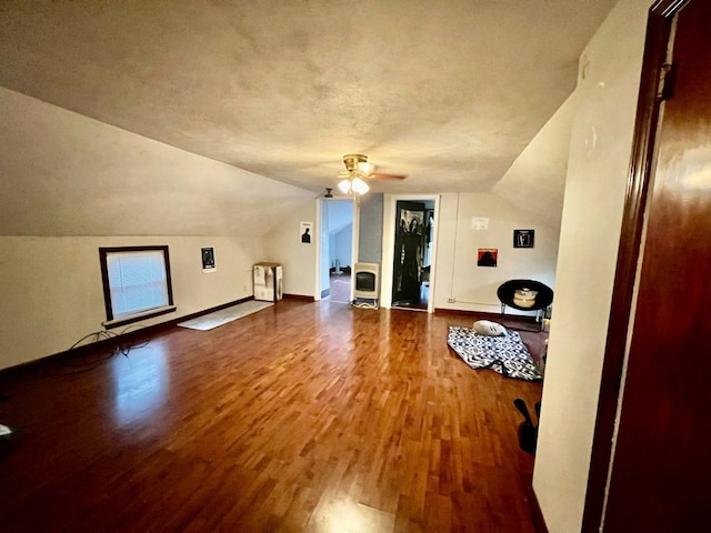 1121 E 27th St, Erie, PA 16504 - additional living space with wood finished floors, lofted ceiling, a ceiling fan, baseboards, and a textured ceiling