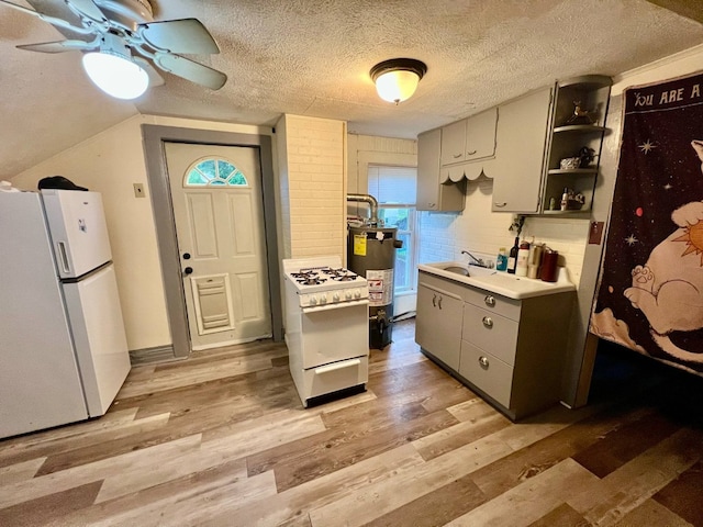 1121 E 27th St, Erie, PA 16504 - kitchen featuring white appliances, a ceiling fan, light wood finished floors, gray cabinets, and a textured ceiling