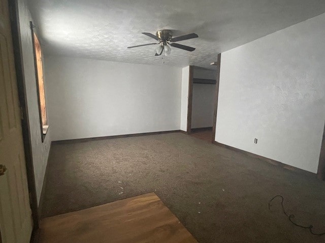 unfurnished room featuring a textured ceiling and ceiling fan